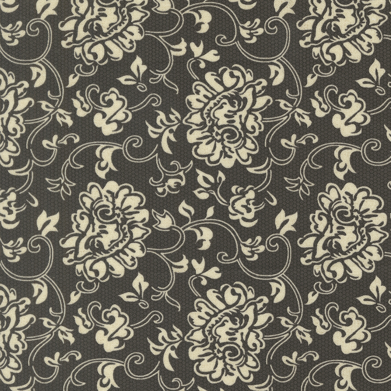 Dainty floral lace pattern in cream on a tonal black and gray halftone background.