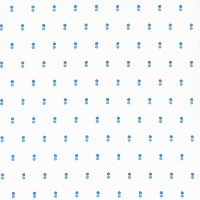 White fabric with rows of parallel dots in light and dark blue.