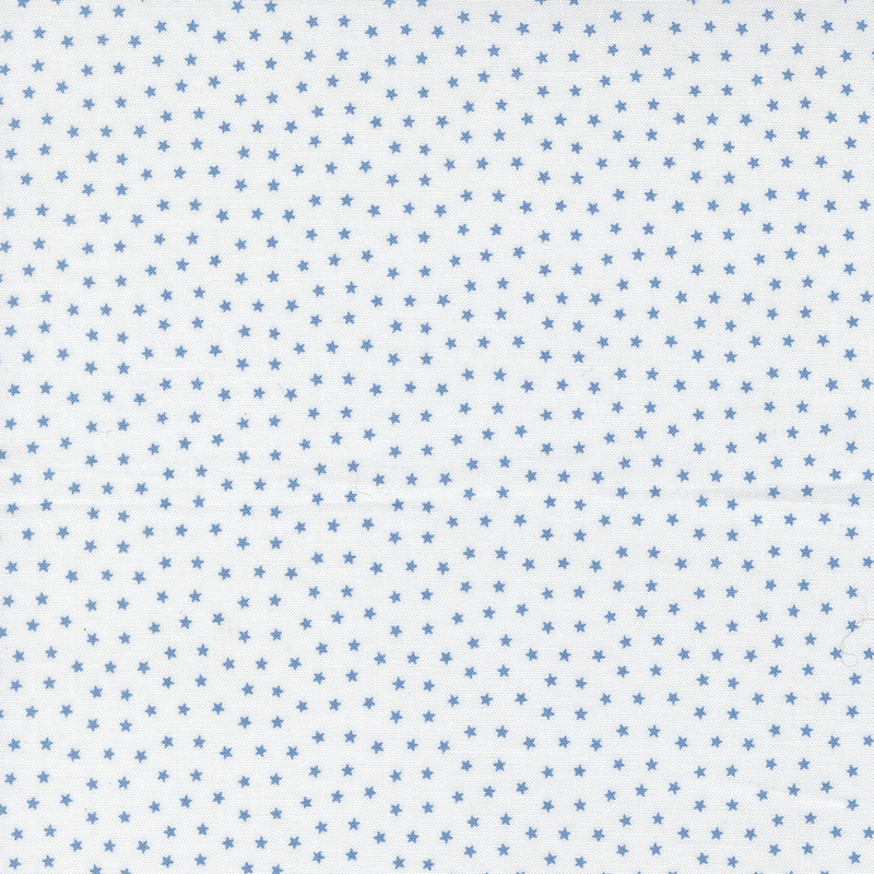White fabric with tiny scattered sky blue stars.