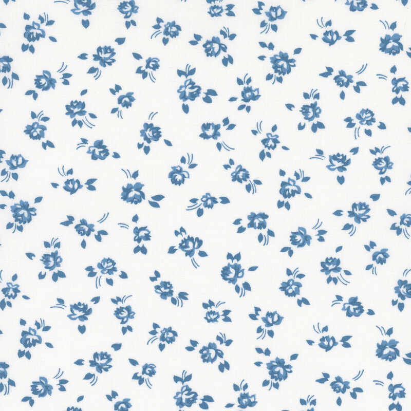 White fabric with small blue tossed florals.
