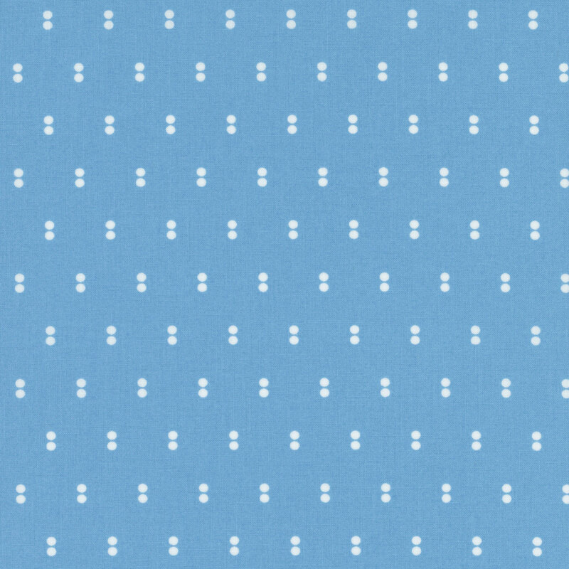 Light blue fabric with rows of parallel white dots.