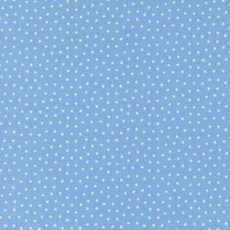 Sky blue fabric with tiny scattered white stars.