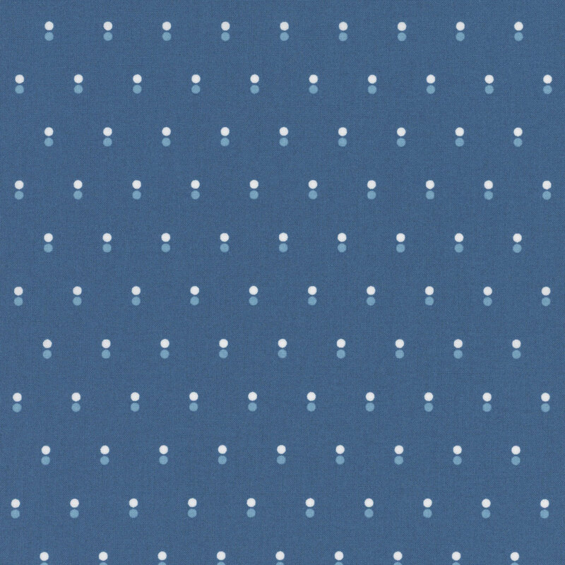 Blue fabric with rows of parallel white and light blue dots.