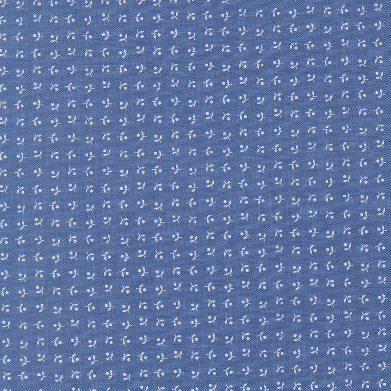 Blue fabric with neat rows of white, ditsy simplified florals.