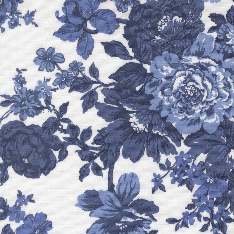 White fabric with dark blue florals and leaves.