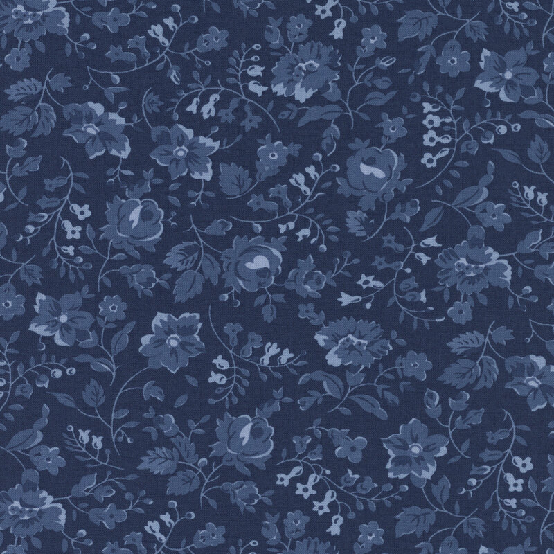 Blue fabric with tonal florals and sprawling leaves and stems.