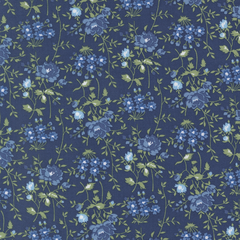 Navy fabric with light blue florals with sprawling green stems.