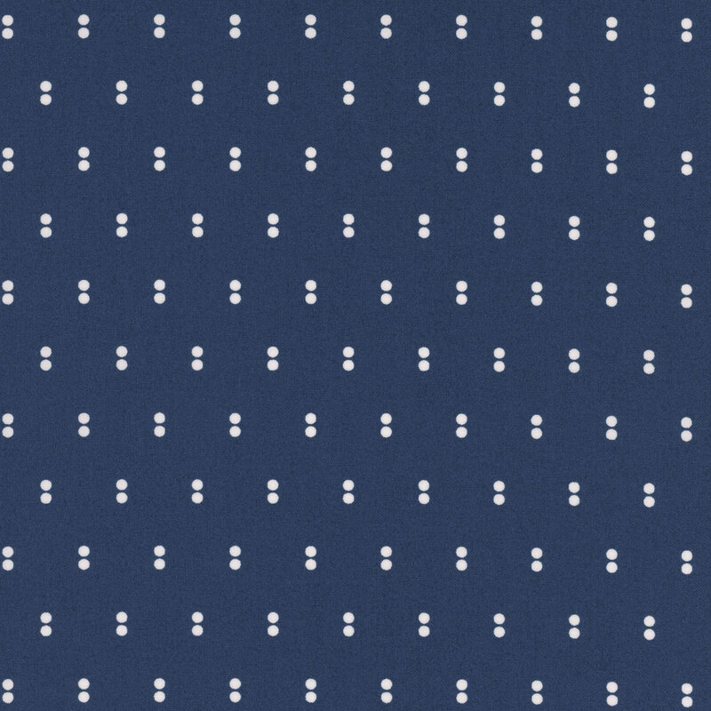 Navy fabric with rows of parallel white dots.