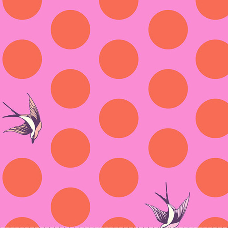 A bright pink fabric with large salmon polka dots and tossed starlings.