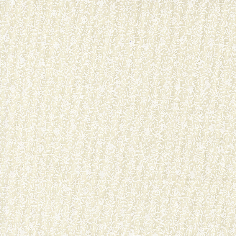 Cream fabric with a white pearlized dense floral and leaf design.