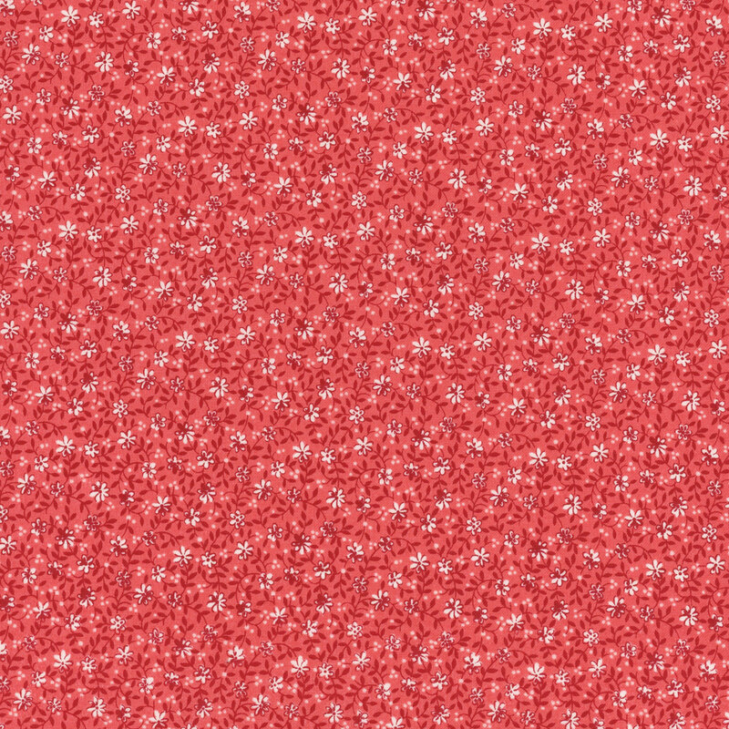 Red fabric with a white and tonal dense floral and leaf design.