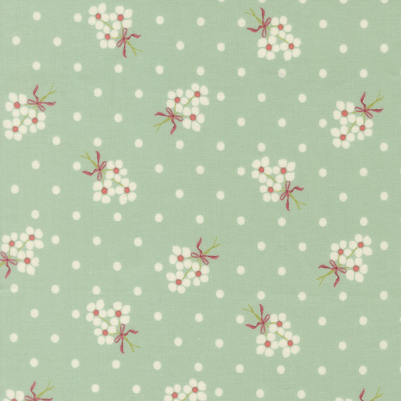 Pale teal fabric with cream polka dots and fluffy cream floral bouquets.