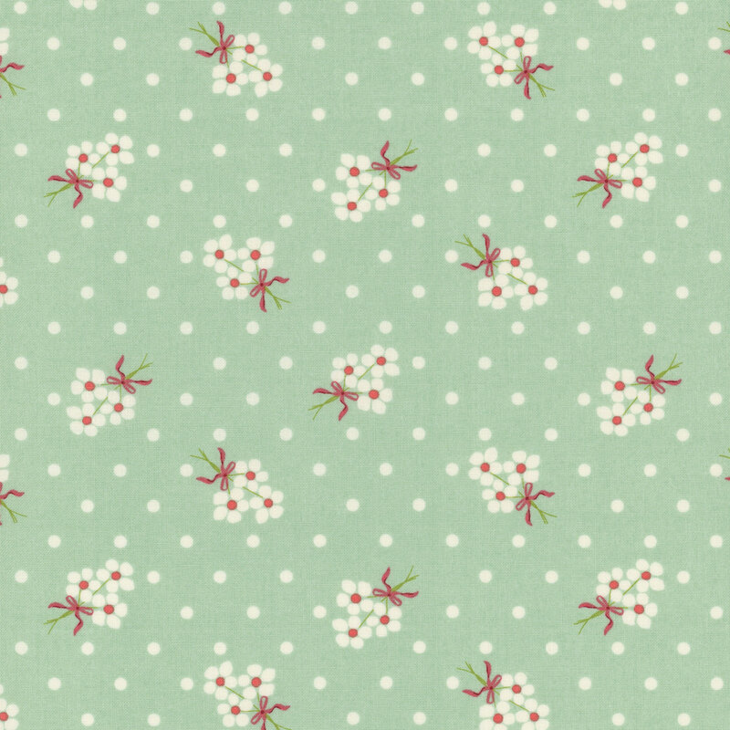 Pale teal fabric with cream polka dots and fluffy cream floral bouquets.