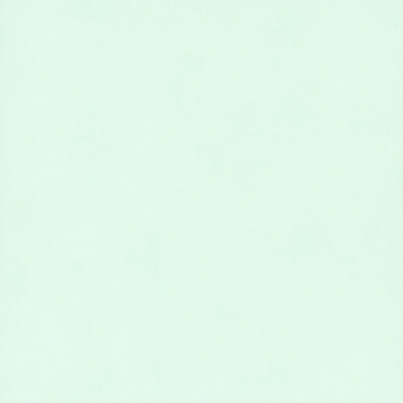 A very lightly textured misty green fabric.