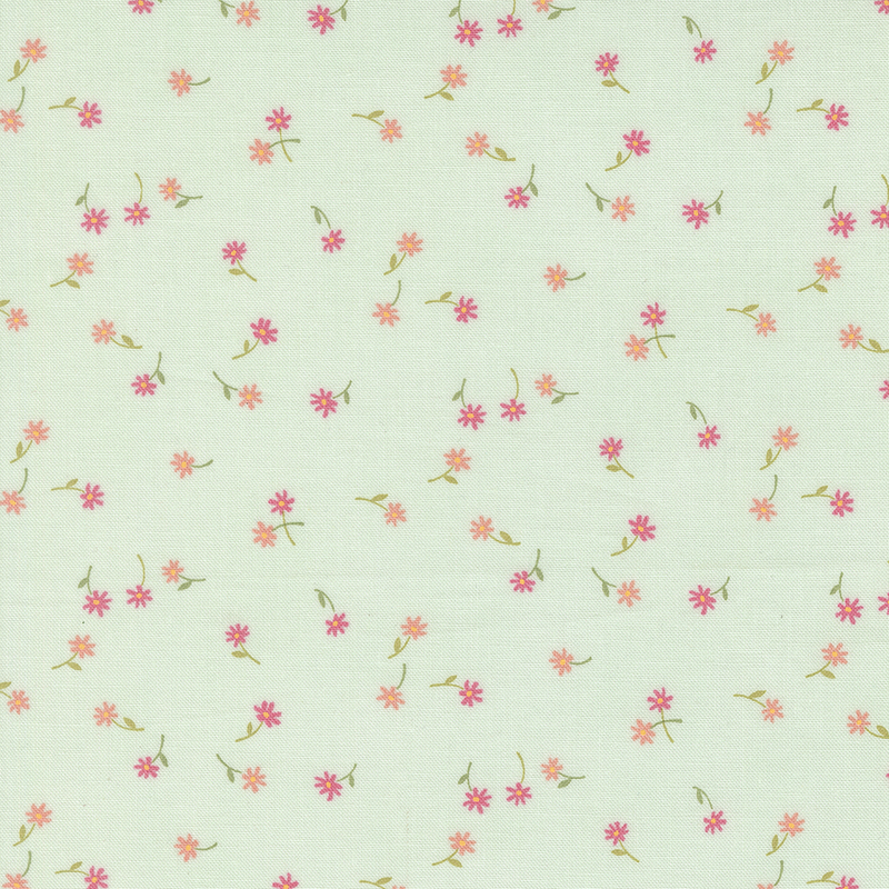 A misty green fabric with tossed small pink and coral flowers and green stems.