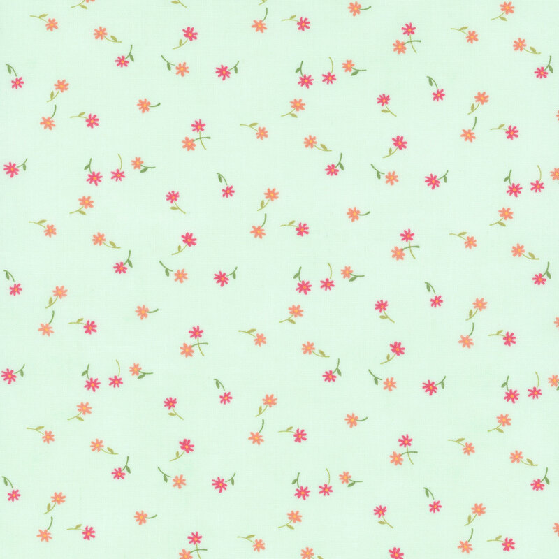 A misty green fabric with tossed small pink and coral flowers and green stems.
