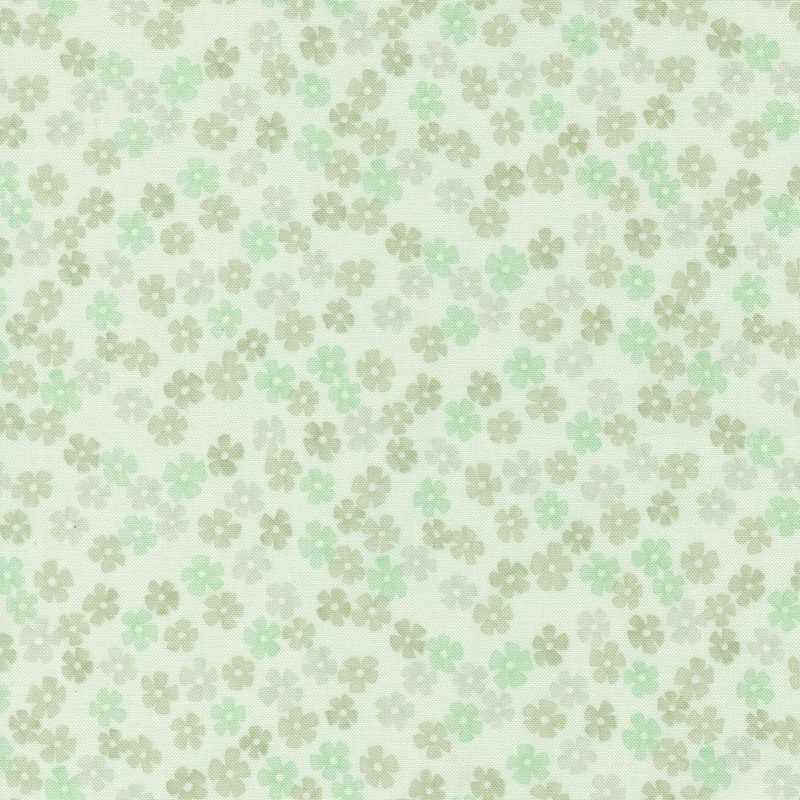 A misty green fabric with small tossed small mint green and tonal flowers.