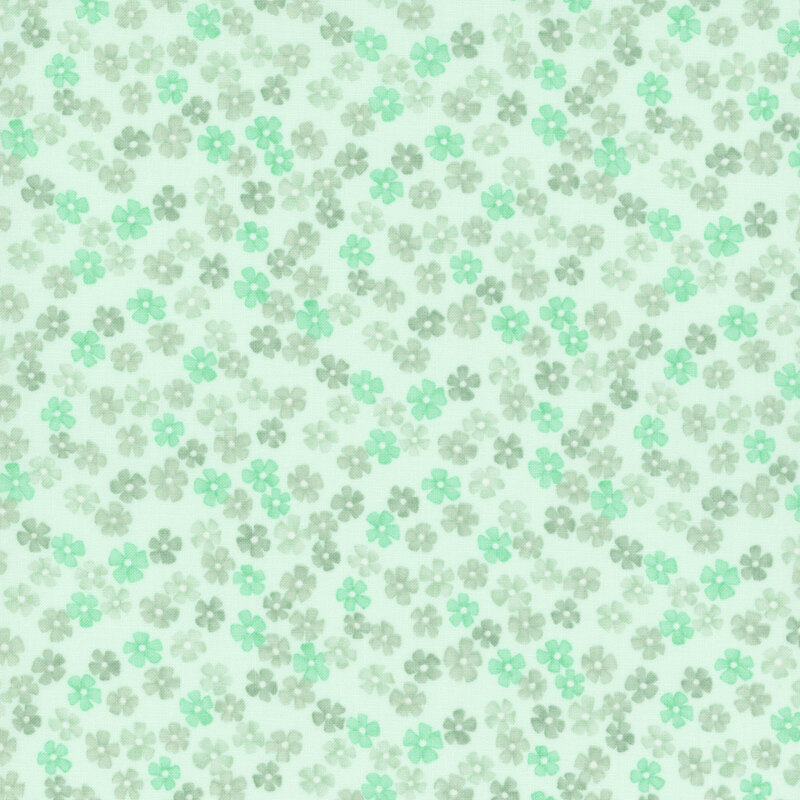 A misty green fabric with small tossed small mint green and tonal flowers.