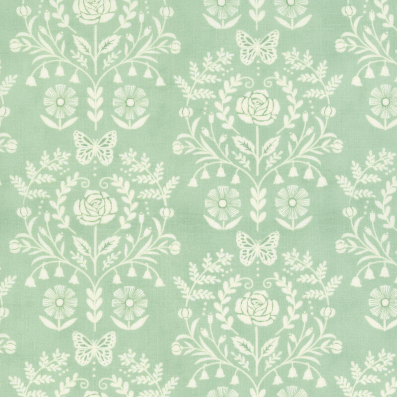 A sage green fabric with a cream damask design.