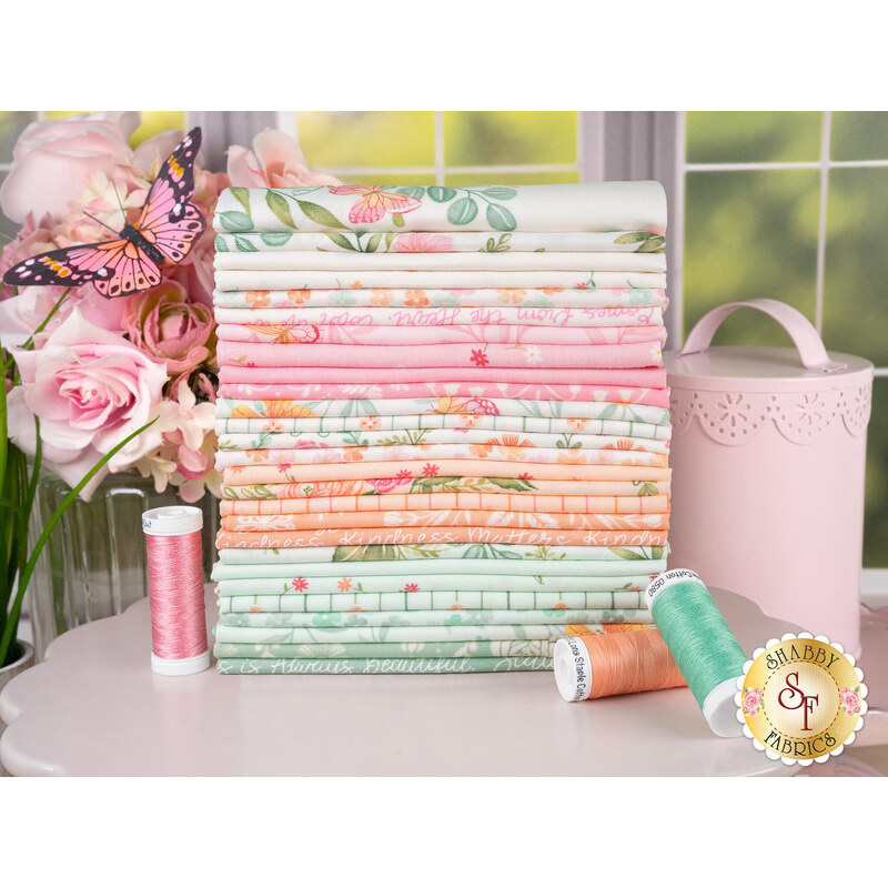A stack of the fabrics featured in the Kindness collection, with flowers and a butterfly and a tin and thread and a window.