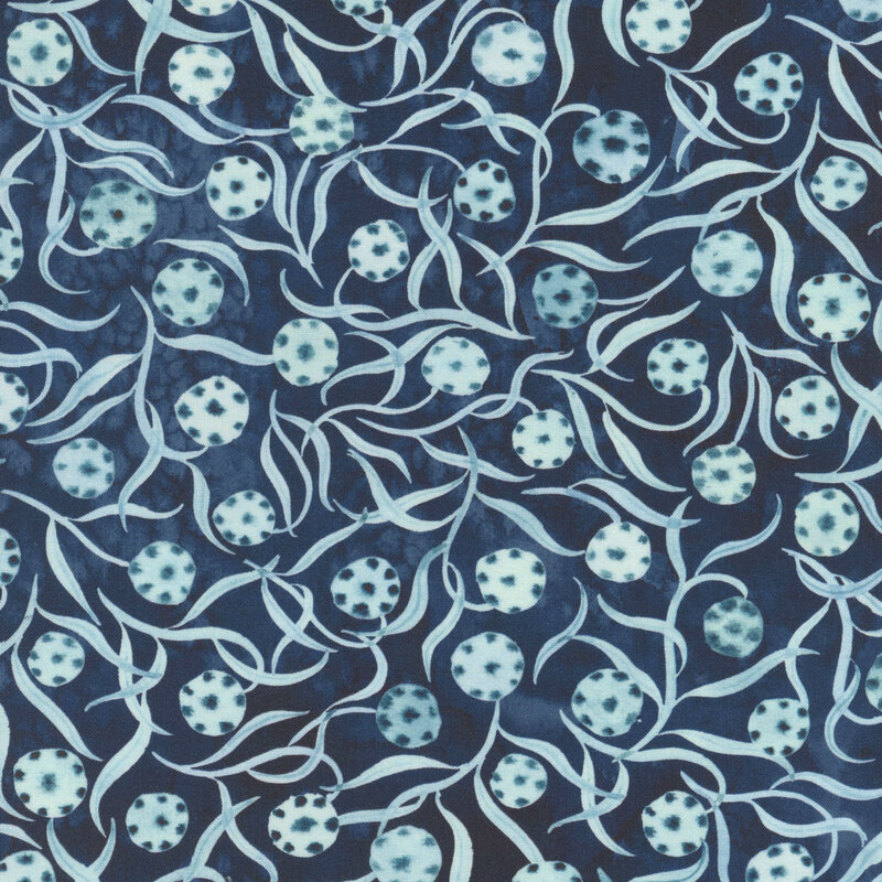 Watercolor fabric featuring light blue leaves and dotted circular shapes on a dark blue background.