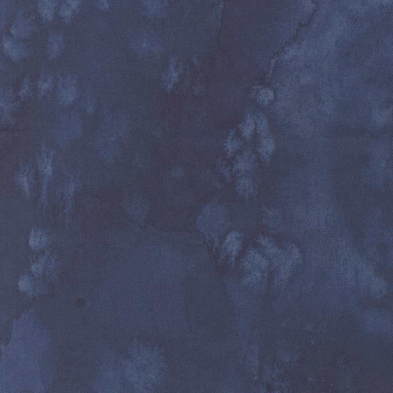 Abstract watercolor texture featuring varying shades of blue.