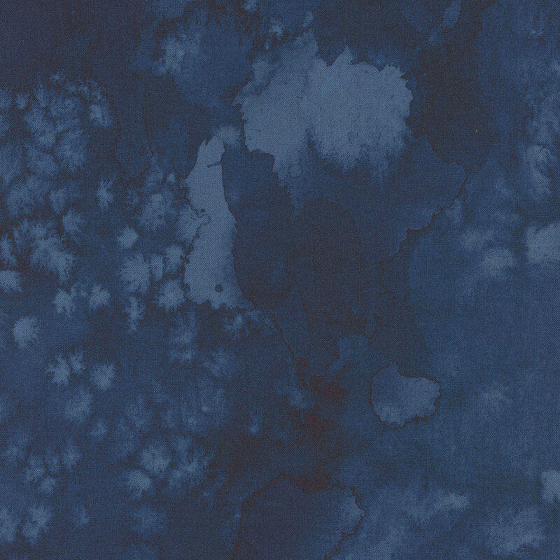 Abstract watercolor texture featuring varying shades of blue.