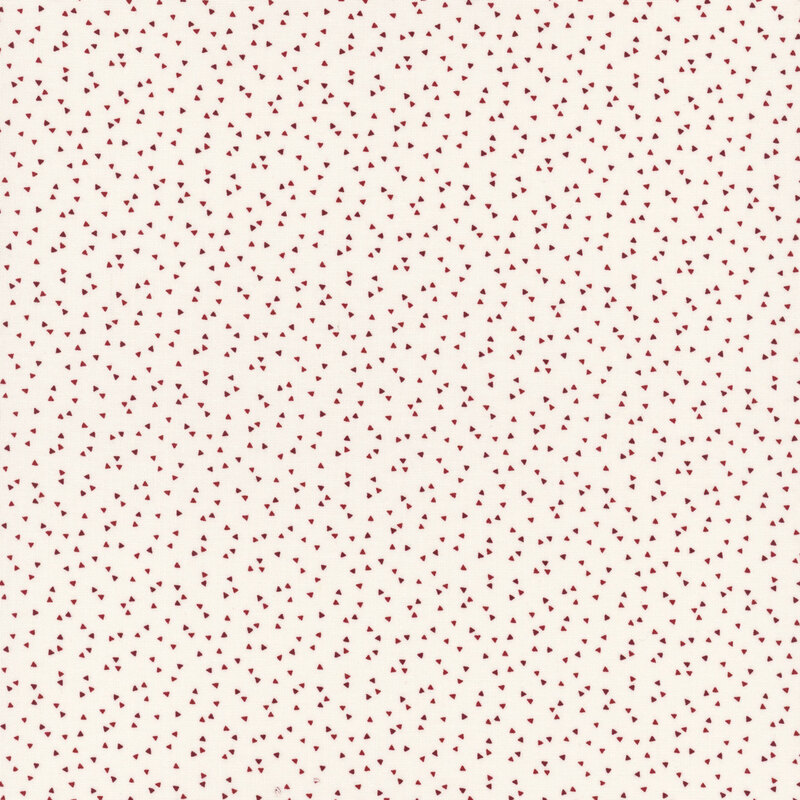 A cream-colored fabric pattern featuring small, scattered red hearts.