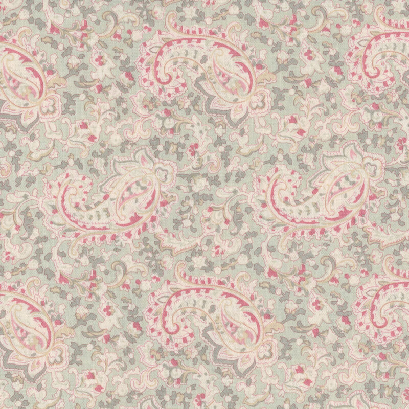 Floral paisley pattern with pink, green, and beige on a light green fabric.