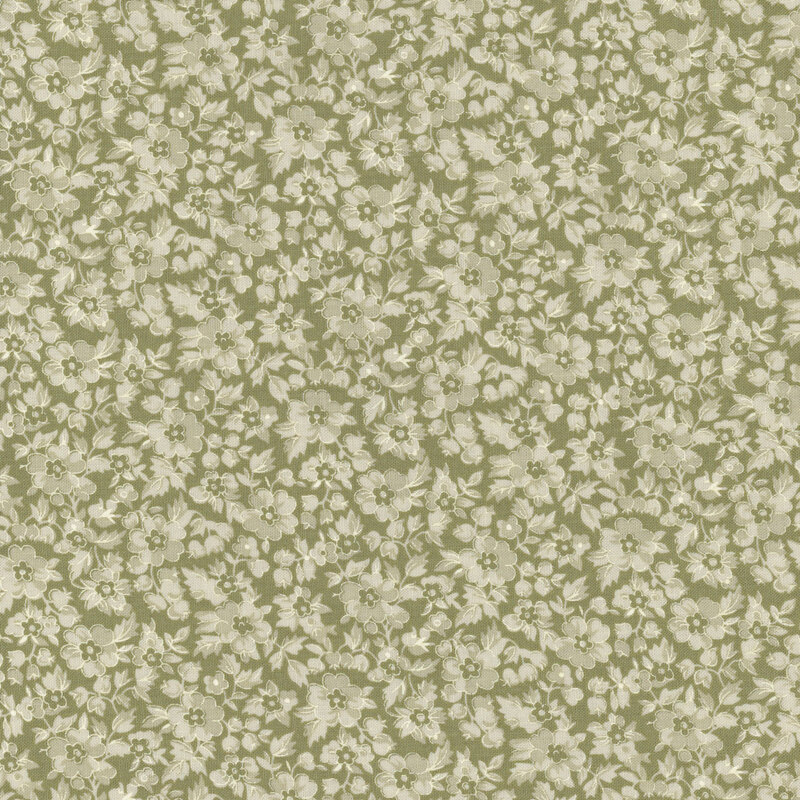 A floral pattern featuring light flowers on a muted olive green fabric.