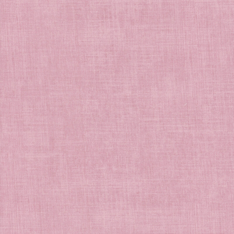 Pink fabric with a subtle texture pattern and varying shades of pink.