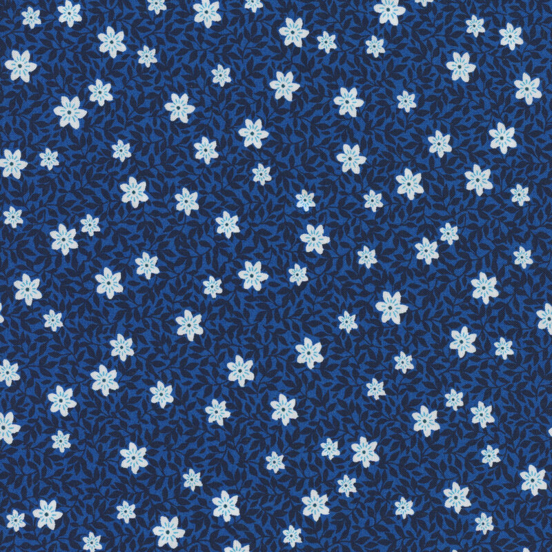 Dark blue fabric with tonal leaves and white florals.