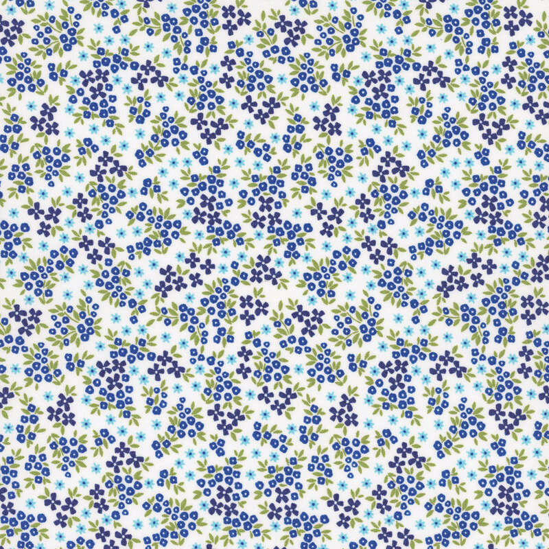 White fabric featuring small dark blue and aqua flowers. 