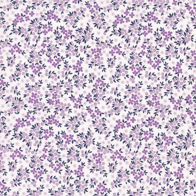 White fabric featuring small light and dark purple flowers. 