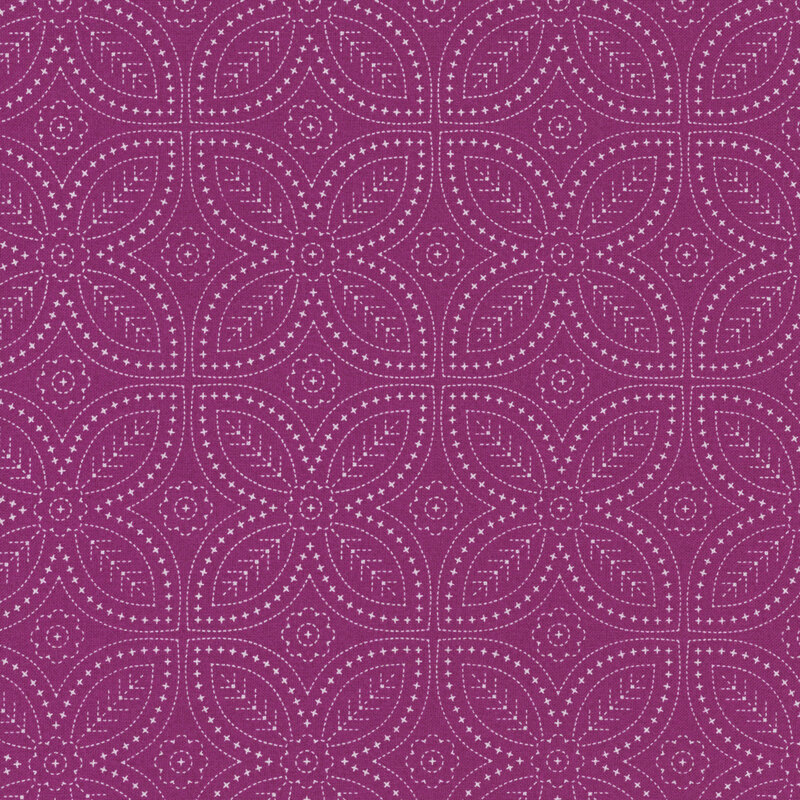 Magenta fabric featuring an intricate floral design