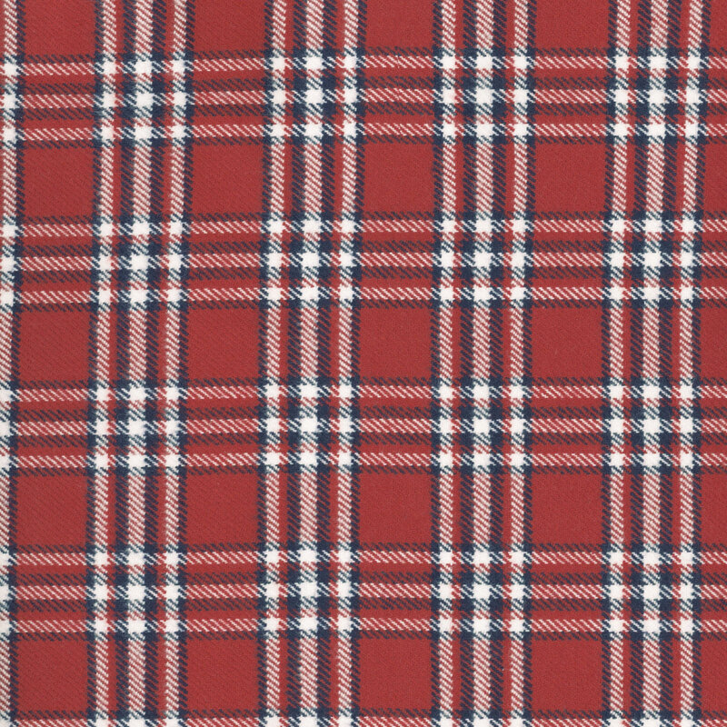 Red flannel fabric with blue and white plaid.