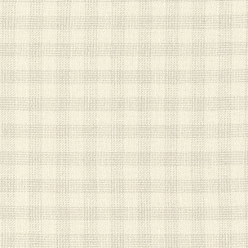 Cream flannel fabric with dotted texture in a plaid pattern.