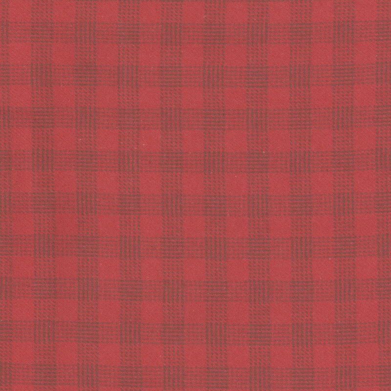 Bright red flannel fabric with tonal dotted plaid.