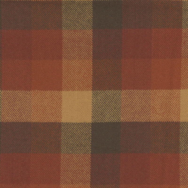 Flannel fabric with brown, orange, pumpkin and tan checkered pattern.