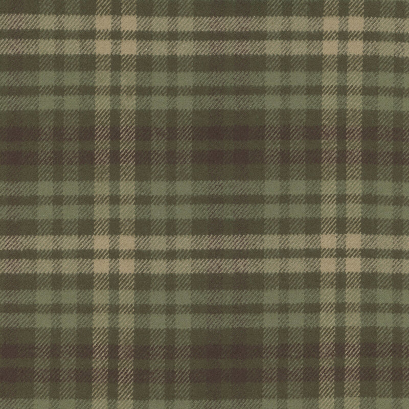 Flannel fabric with a green and brown plaid pattern.