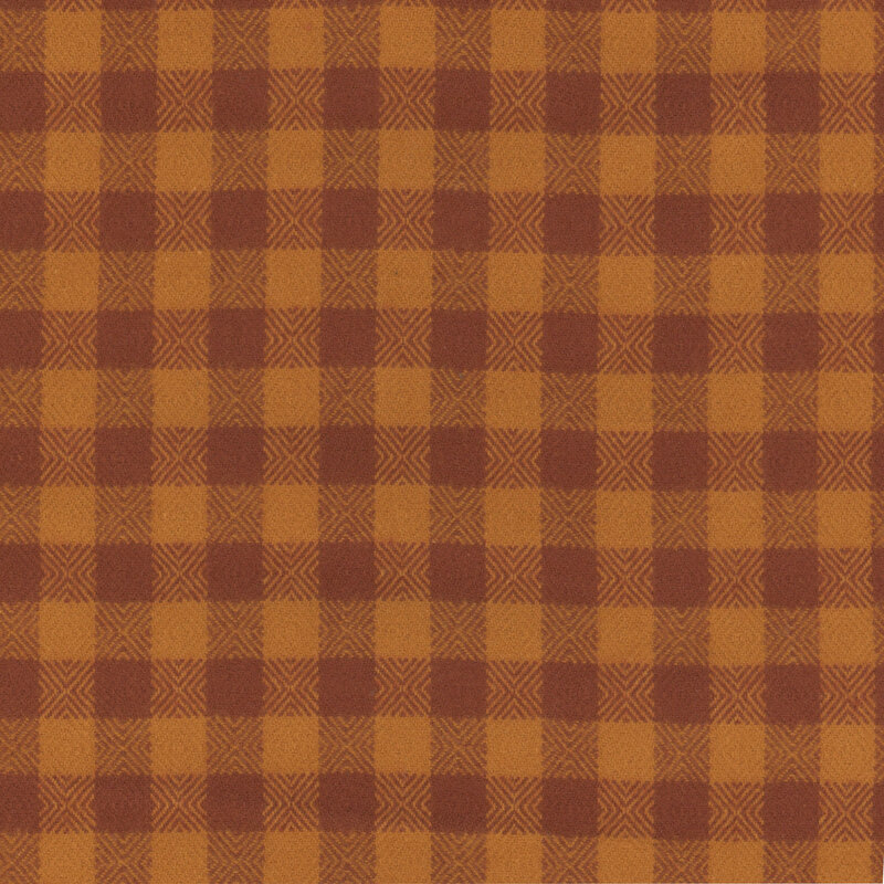 Flannel fabric in a brown and orange gingham pattern.