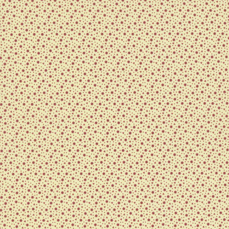 Cream fabric with tiny red stars and berry clusters.