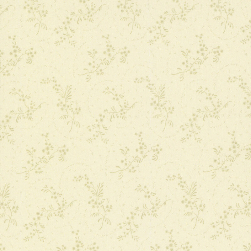 Cream fabric with tonal tossed leafy springs on an ornate background.