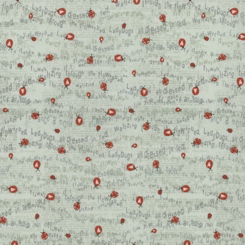 Dusty aqua fabric with tiny ladybugs crawling over wavy lines of words from a ladybug poem.