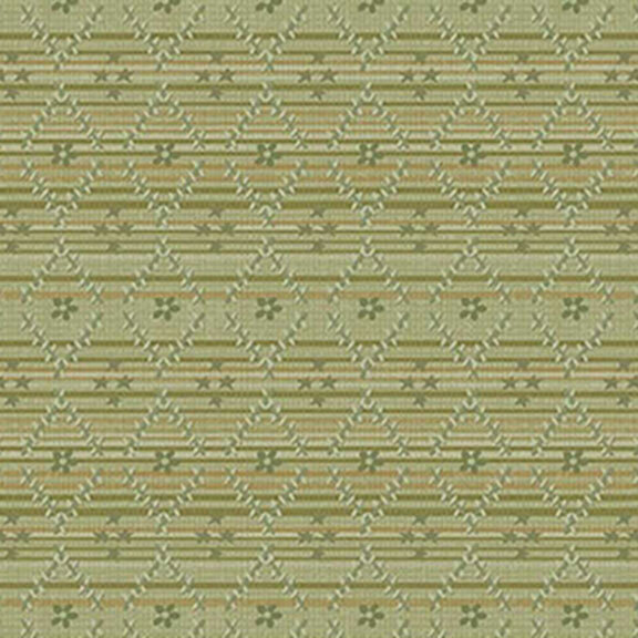 Textured green fabric featuring floral and star diamond shapes with subtle decorative lines.