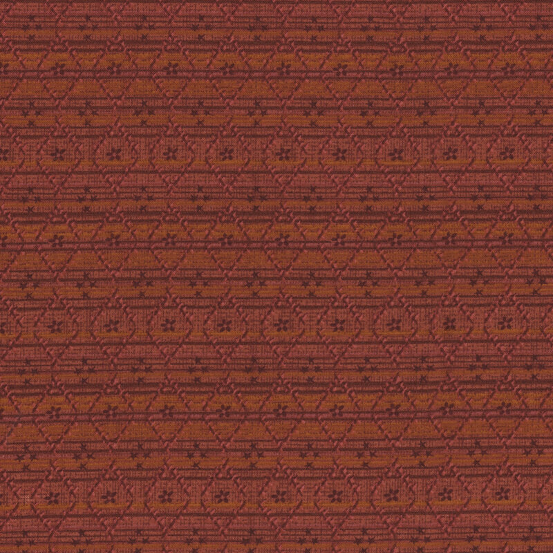 Textured red fabric featuring floral and star diamond shapes with subtle decorative lines.