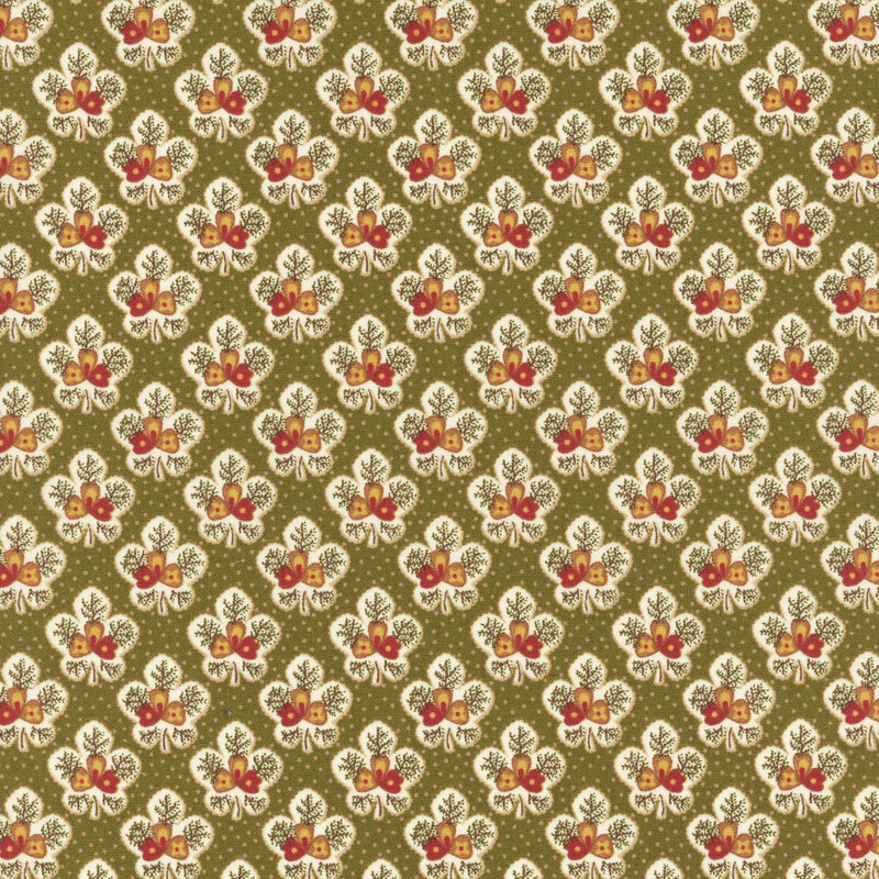 Green fabric featuring half-drop ornamental and floral patterns in white, red, and yellow.