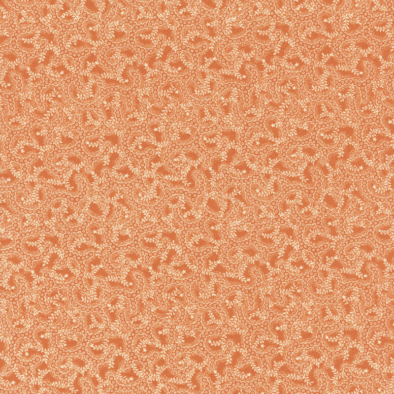 Peach fabric with light beige swirling vines and leaf patterns.
