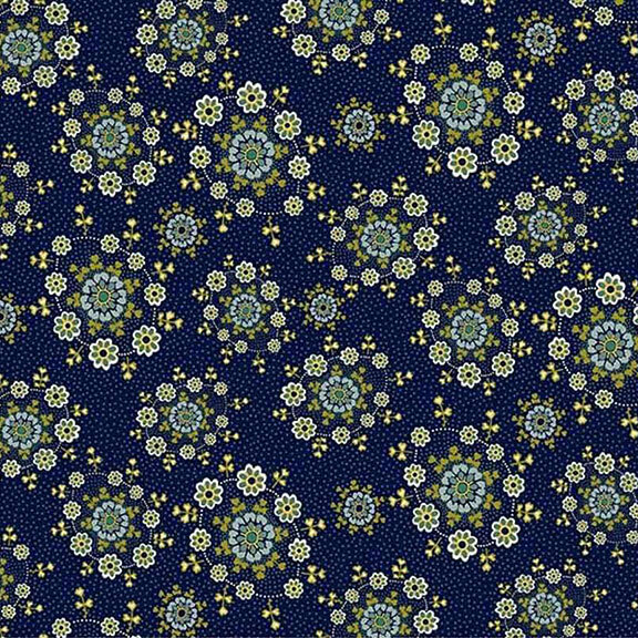 Green and white daisy wreaths tossed on a navy blue fabric.
