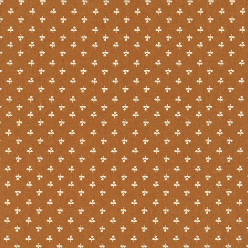 Orange fabric featuring a print of white tulips.